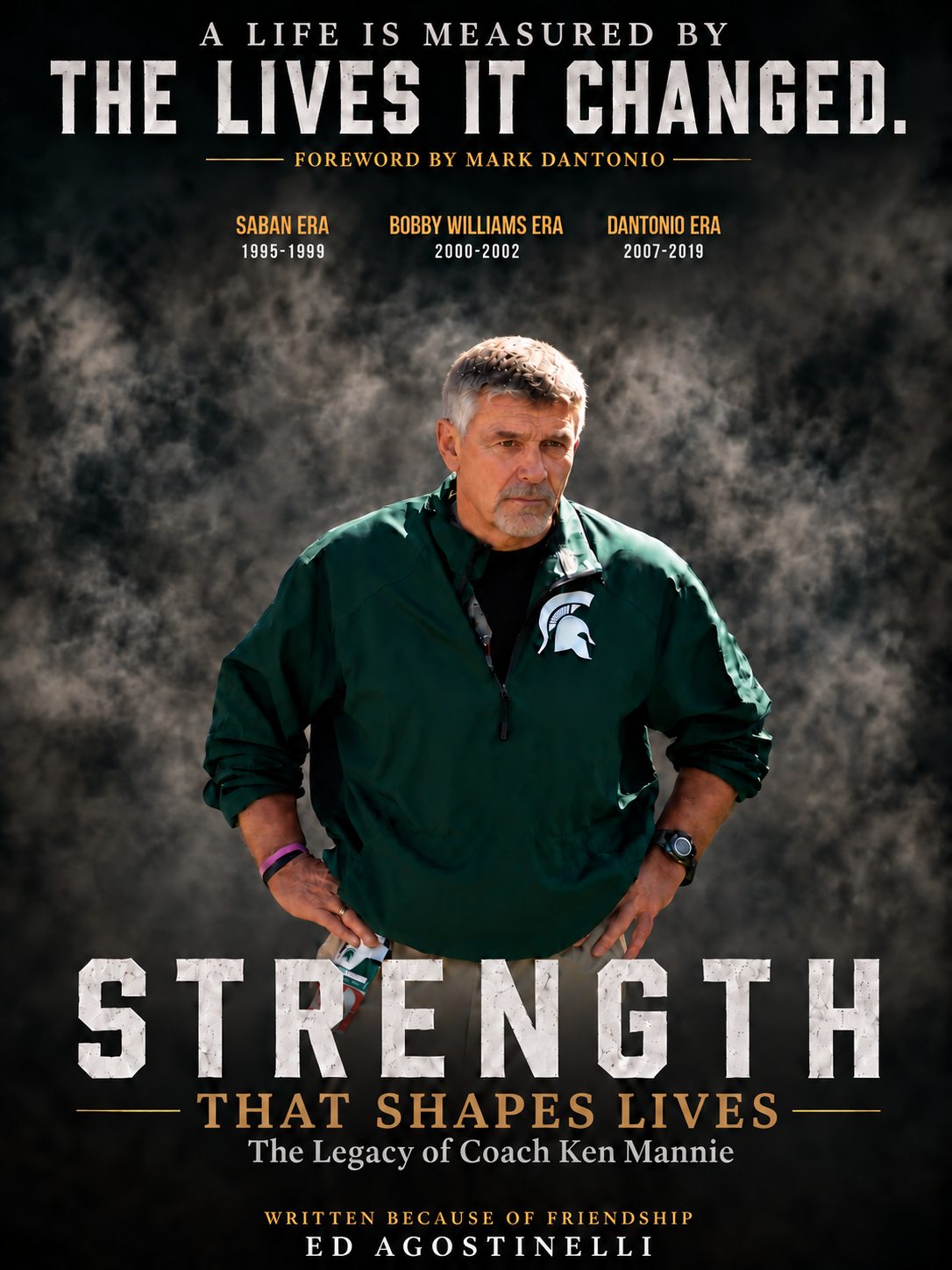 Book cover: Strength That Shapes Lives, The Legacy of Coach Ken Mannie, by Ed Agostinelli, foreword by Mark Dantonio. Coach Mannie stands in a green Michigan State jacket.